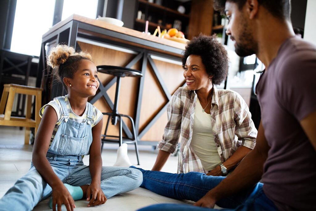 family members seated in a group circle practicing techniques for how to improve family communication