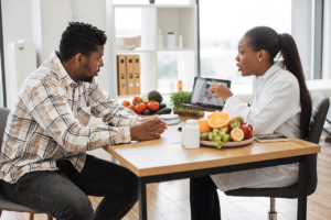 Two people discussing the importance of nutrition counseling during recovery